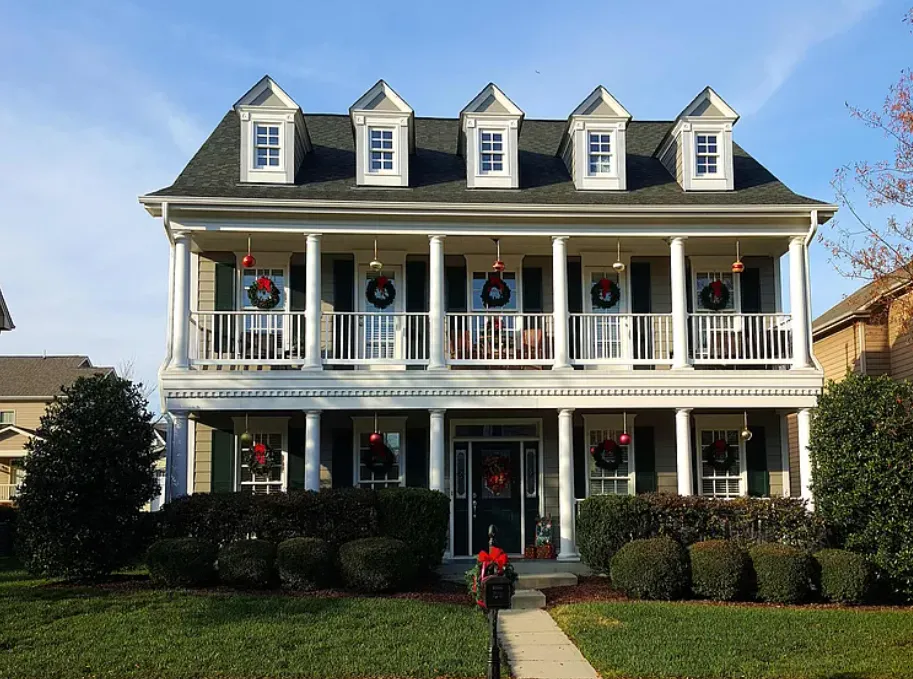 Two-story colonial home with holiday decorations